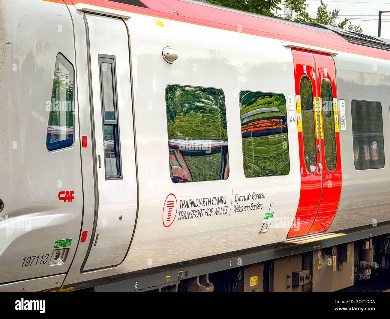 Pontyclun, Wales, UK - 20 June 2025: Close up view of a Transport for Wales Class 197 commuter train - Smartphone Captured Stock Image