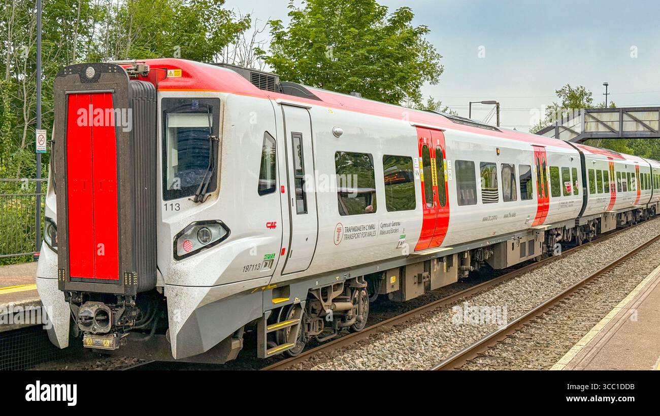 Pontyclun, Wales, UK - 20 June 2025: Transport for Wales Class 197 commuter train stopped at the railway station in the village of Pontyclun - Smartphone Captured Stock Image