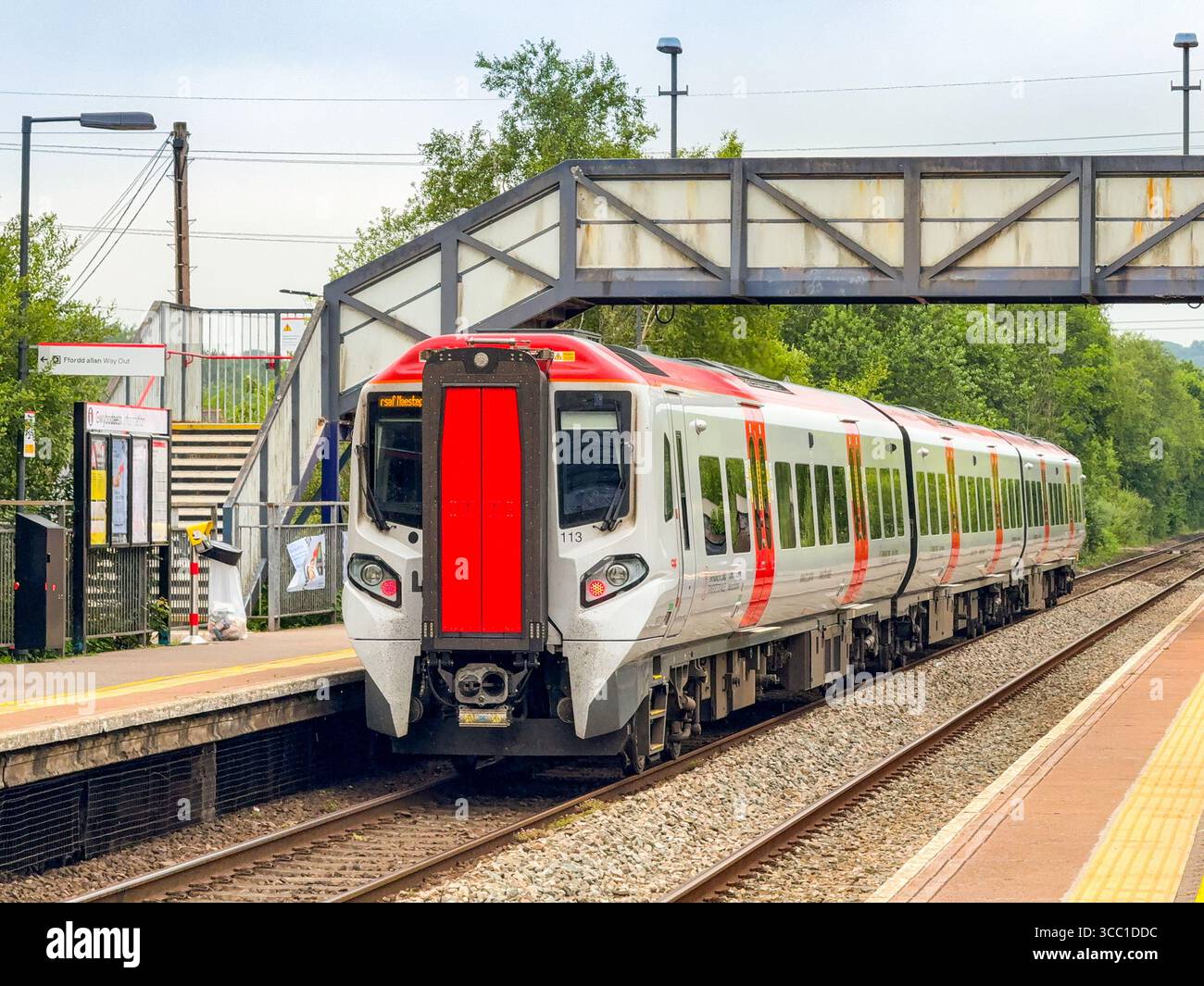 Pontyclun, Wales, UK - 20 June 2025: Transport for Wales Class 197 commuter train leaving the railway station in the village of Pontyclun - Smartphone Captured Stock Image