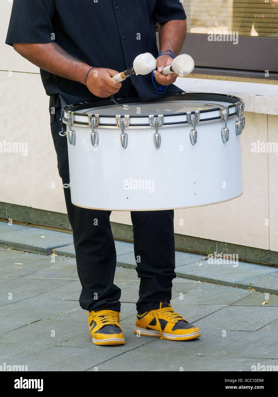 Musicians playing snare drum and bass drum outdoors, percussion ...
