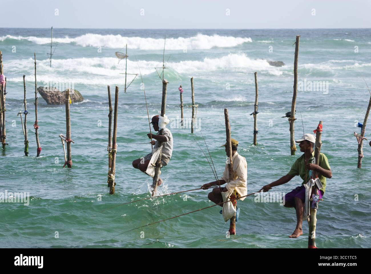 Traditional stilt fishing in Weligama Bay area, Sri Lanka Stock Photo ...
