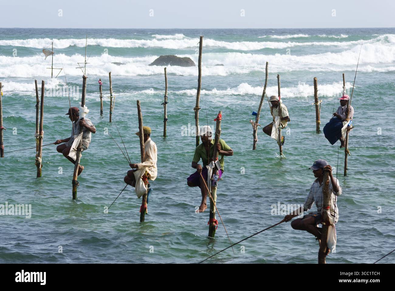 Traditional stilt fishing in Weligama Bay area, Sri Lanka Stock Photo ...