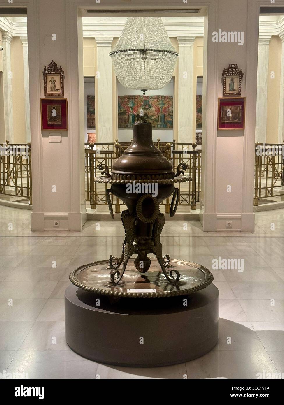 Interior view of the Benaki Museum in Athens, Greece, featuring a central antique exhibit and neoclassical architecture. - Smartphone Captured Stock Image Interior view of the Benaki Museum in Athens, Greece, featuring a central antique exhibit and neoclassical architecture. - Smartphone Captured Stock Image