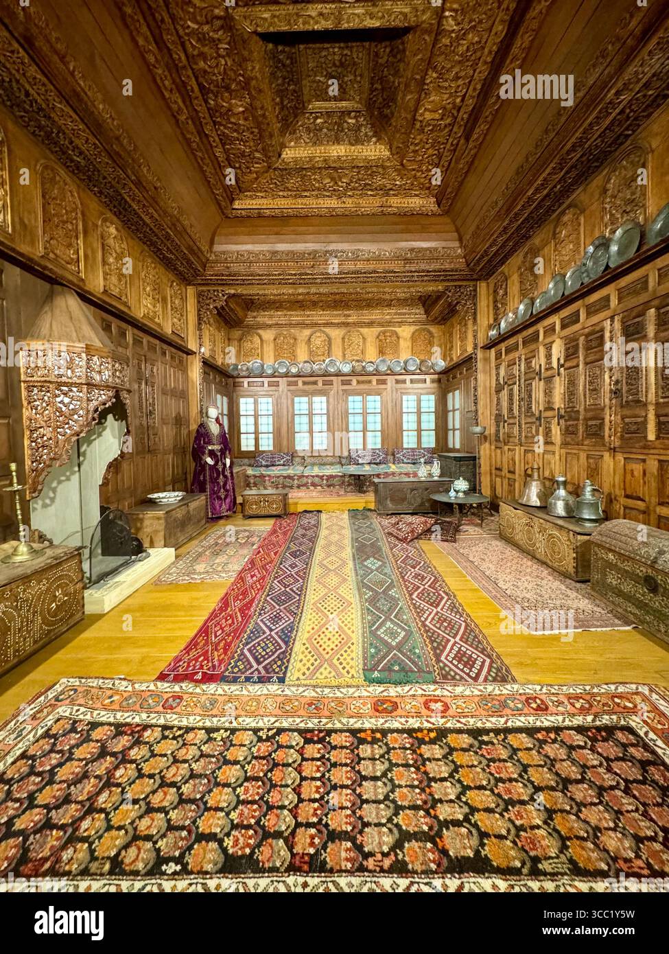 Interior views of a traditional ornately decorated room at Benaki Museum in Athens, showcasing historic Greek cultural heritage and craftsmanship. - Smartphone Captured Stock Image