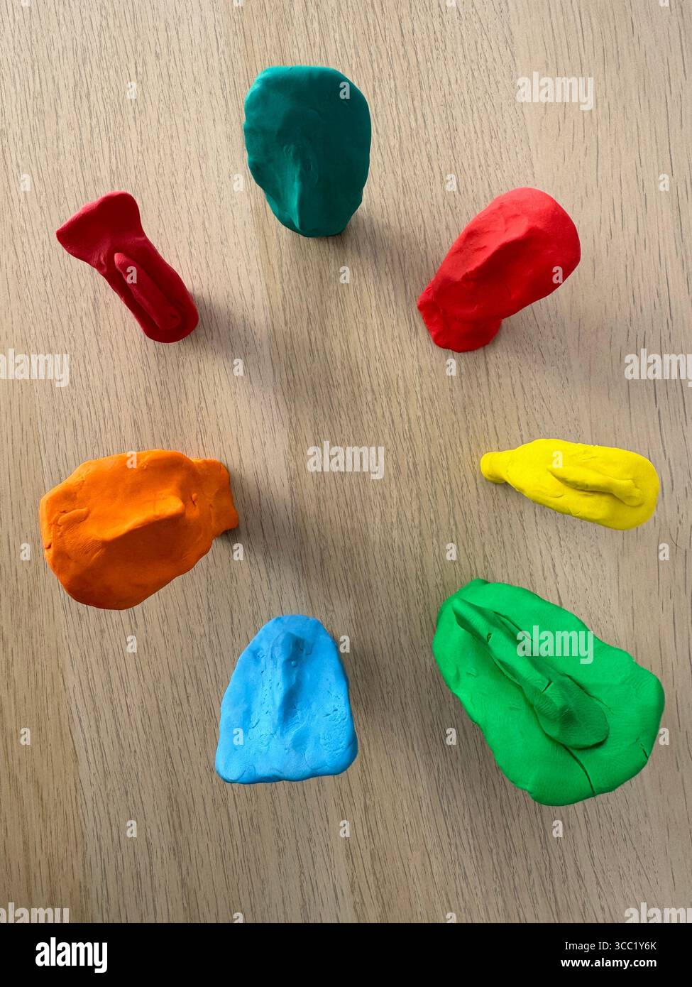 Colorful Cycladic clay figurines created during a teacher training session. - Smartphone Captured Stock Image