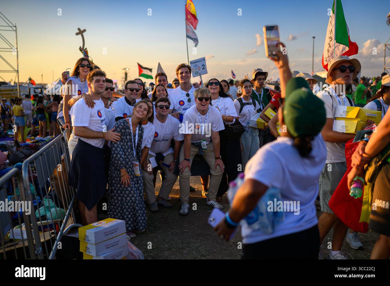 A group of young pilgrims posing for a photo just before the start of the vigil at the Tor Vergata camp during the Youth Jubilee. Stock Photo