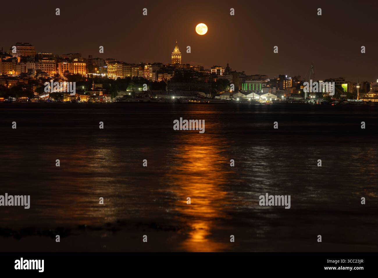 A full Sturgeon moon rises behind Galata tower in Istanbul, Saturday ...