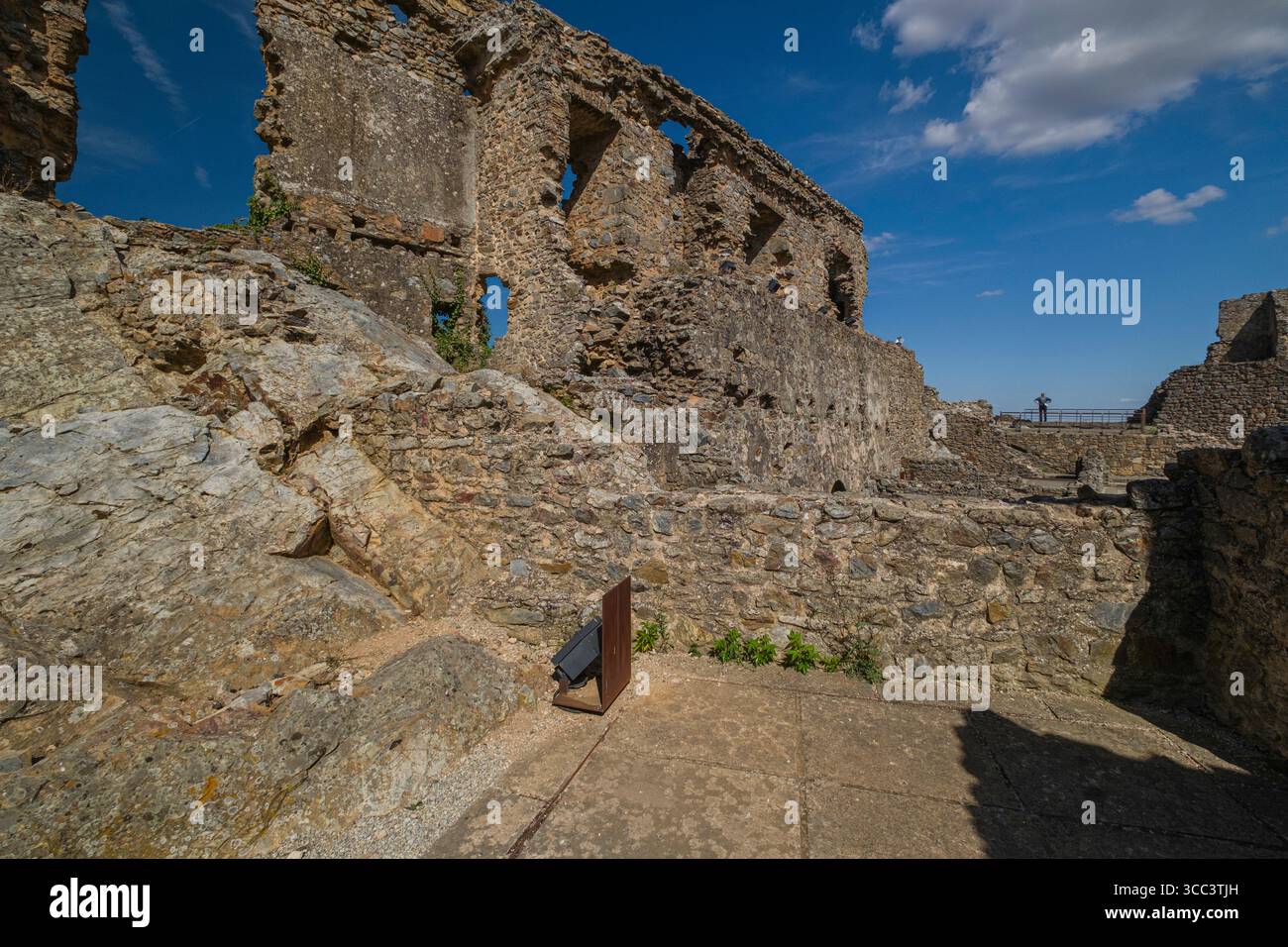 Tourist exploring the ruins of Castelo Rodrigo's medieval castle ...