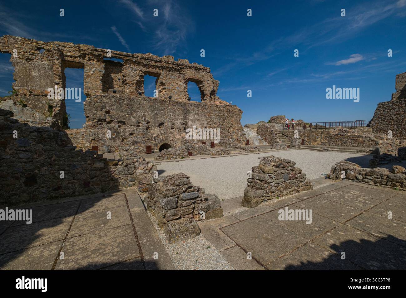 Tourist exploring the ruins of Castelo Rodrigo's medieval castle ...