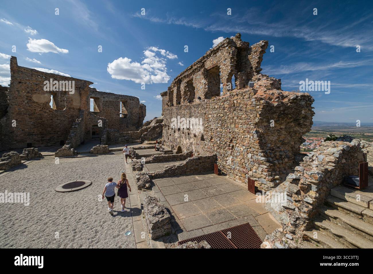 Tourist exploring the ruins of Castelo Rodrigo's medieval castle ...