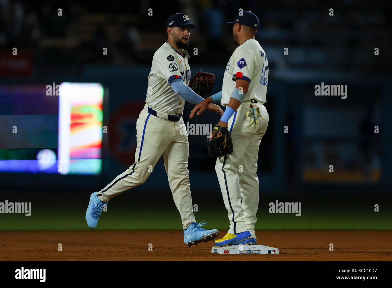 Los Angeles Dodgers' Andy Pages, left, and Miguel Rojas celebrate after ...