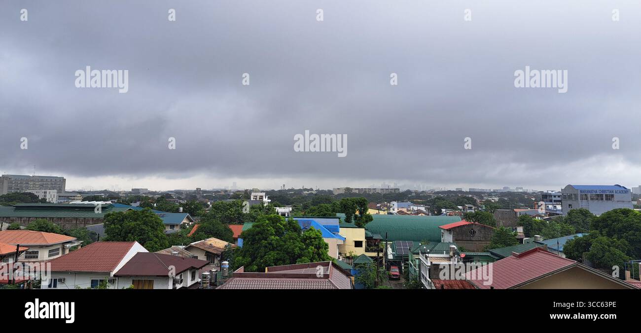 Clouds Over Houses Stock Photo