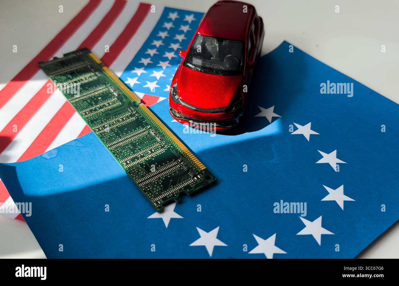 toy car model and microcircuit chip flag of the USA and the European Union Stock Photo