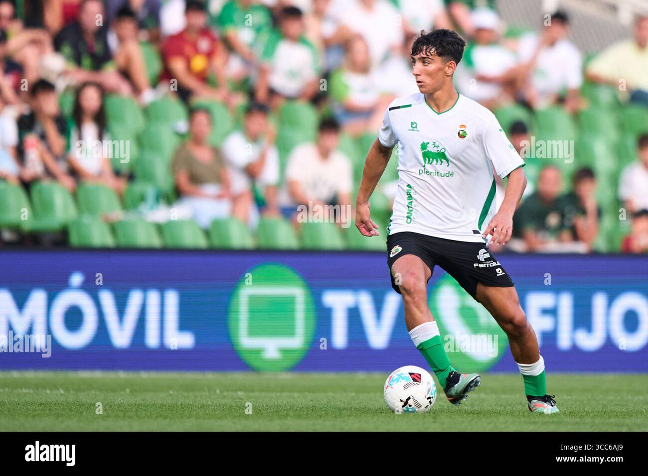Sergio Martinez of Real Racing Club with the ball during the Pre-Season  Friendly match between Racing de Santander and Cagliari Calcio at Campos de  Sp Stock Photo - Alamy, image size:1300x956