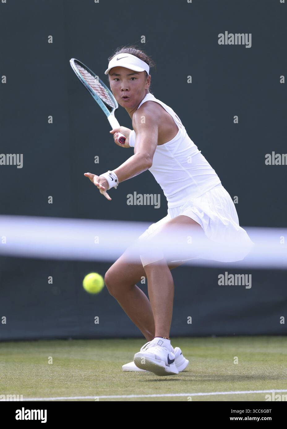 Chinese tennis player Yue Yuan (CHN) in action at the 2025 Wimbledon ...