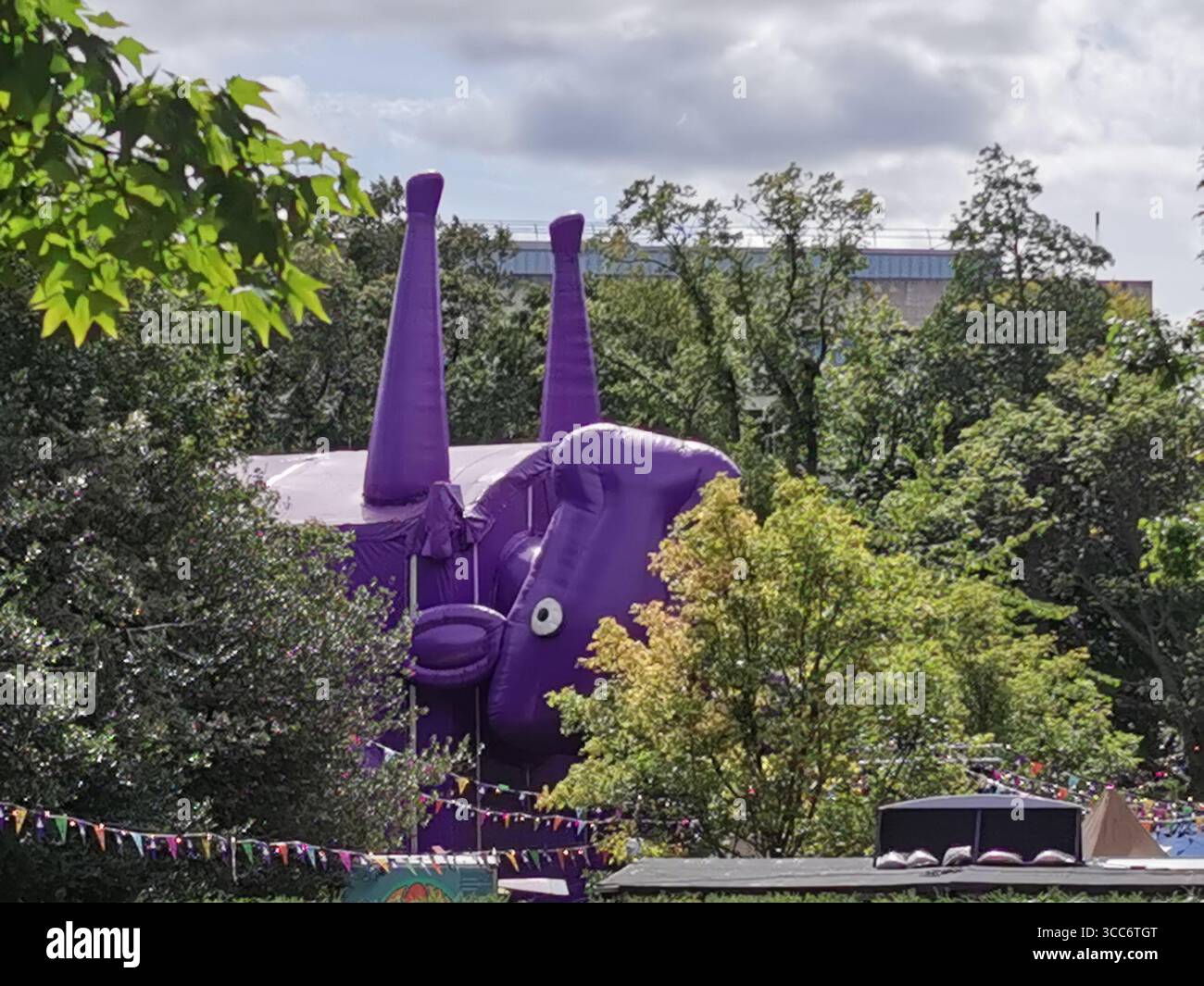 The Underbelly upside down giant purple cow tent venue in George Square Gardens Edinburgh for the Edinburgh Fringe Festival. - Smartphone Captured Stock Image