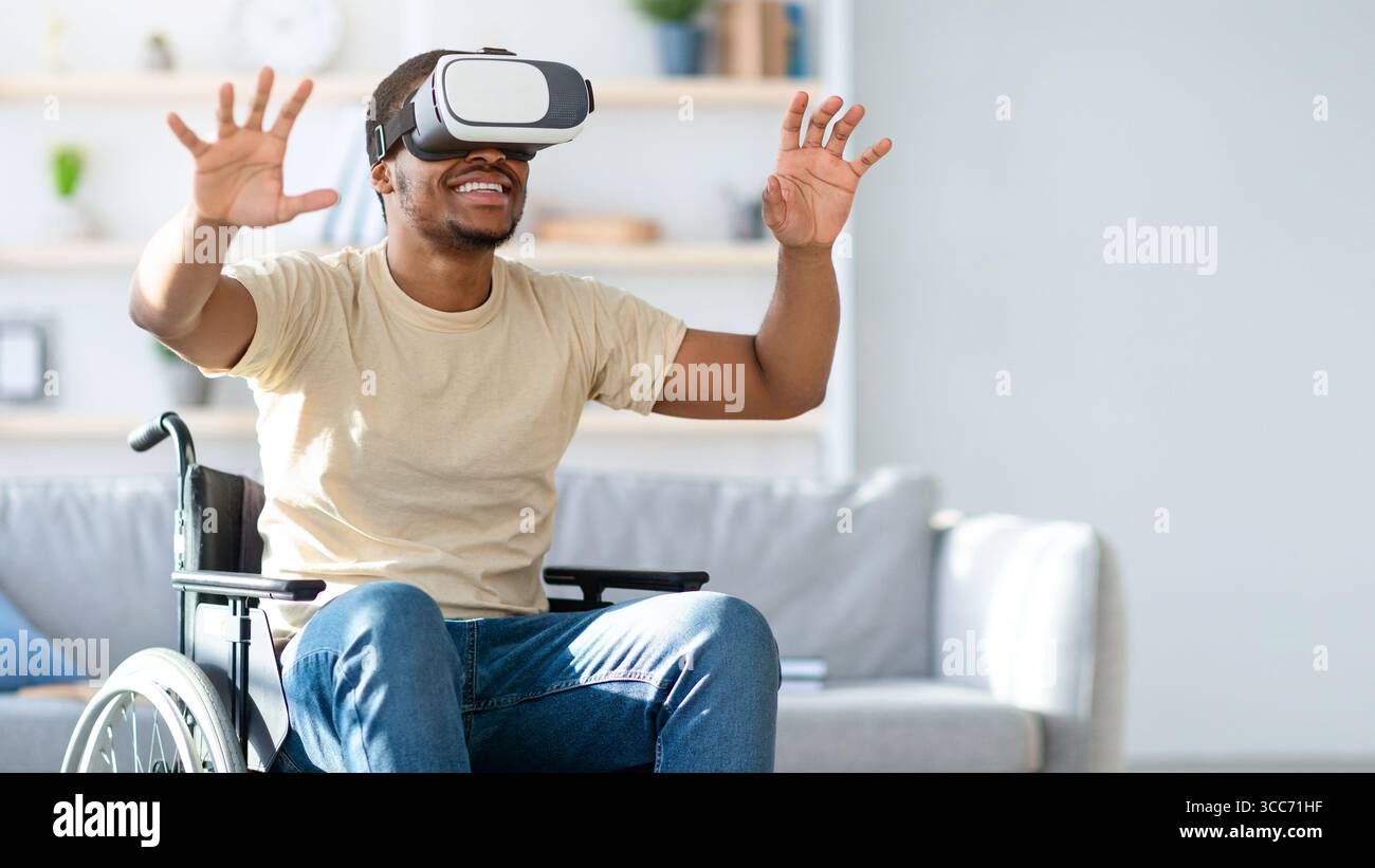 Black man in wheelchair exploring augmented reality in VR headset at ...