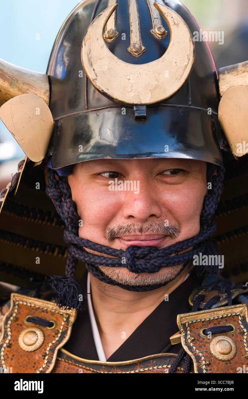 Close-up of man’s face dressed as Japanese feudal samurai before the start of the Machida Jidai Festival historical reenactment, Old Machida Highway, Stock Photo