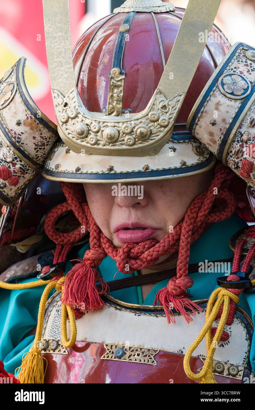 Close-up of man’s face dressed as Japanese feudal samurai before the start of the Machida Jidai Festival historical reenactment, Old Machida Highway, Stock Photo