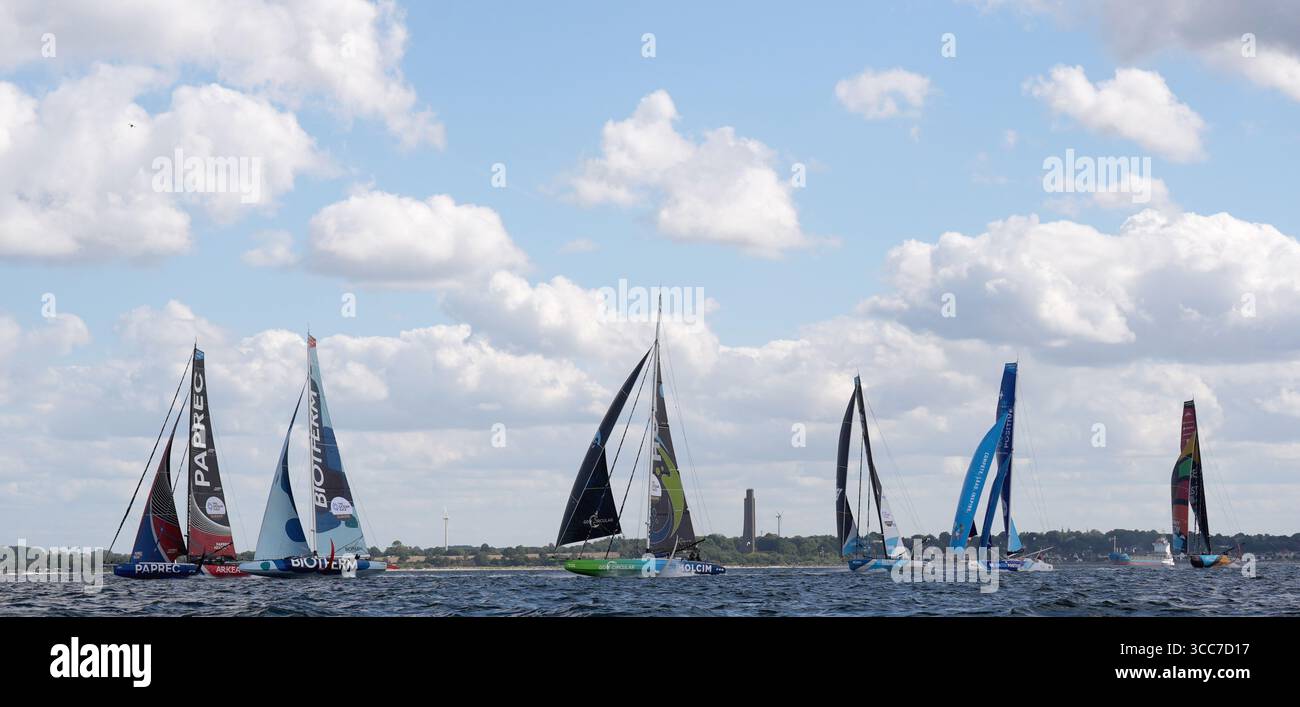 10 August 2025, Schleswig-Holstein, Kiel: Sailing, Ocean Race Europe, start of the regatta over 6 legs in Europe. The racing yachts of Team Paprec - Arkea (l-r), Team Biotherm, Team Holcim - PRB, Team Allagrande Mapei Racing, Team Canada Ocean Racing - Be Water Positive and Team Malizia start on the Kiel Fjord. Photo: Marcus Brandt/dpa Stock Photo
