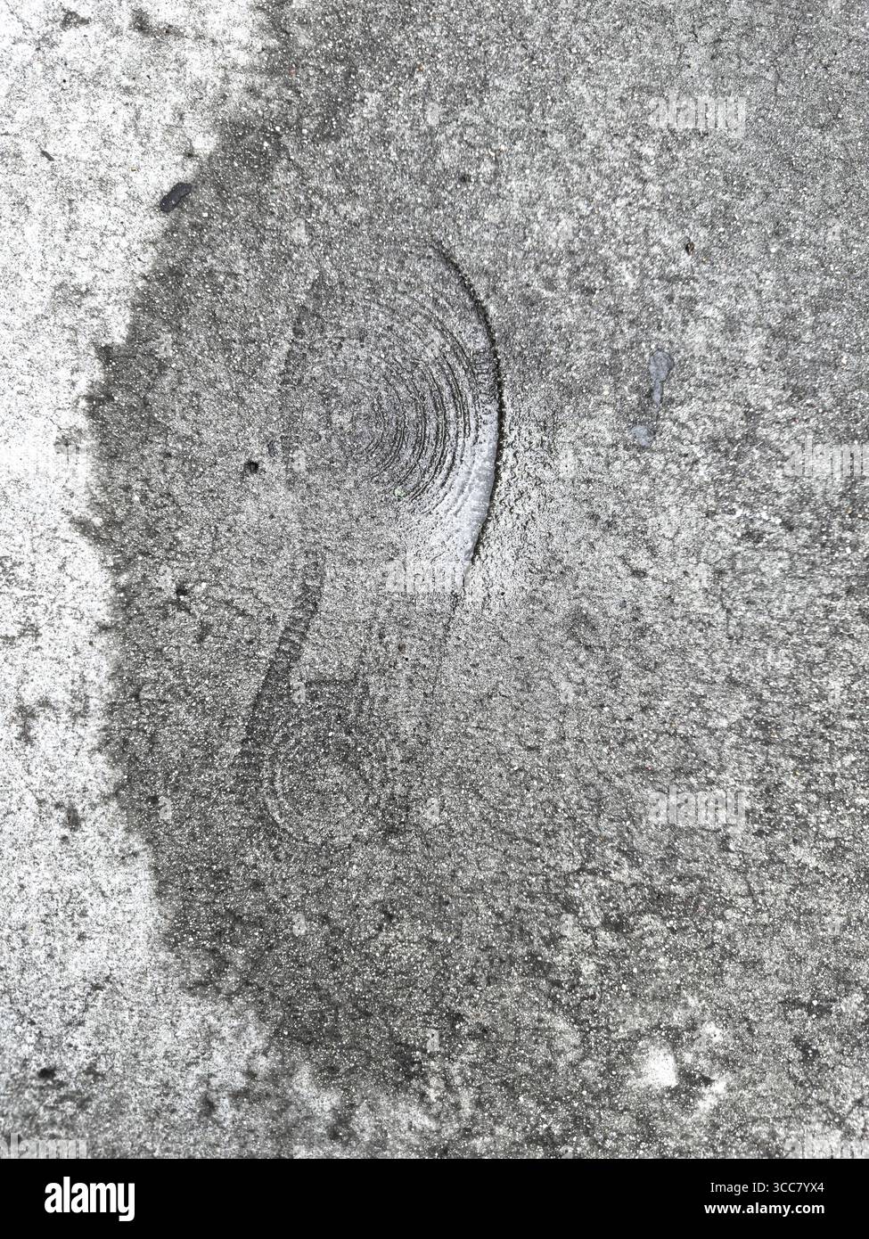 Human footprint on sidewalk cement - Smartphone Captured Stock Image