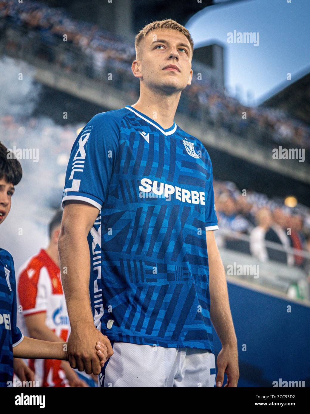 Mateusz Skrzypczak walks out of the tunnel at the stadium in Poznań ahead of the UEFA Champions League qualifying match against Crvena Zvezda. Stock Photo