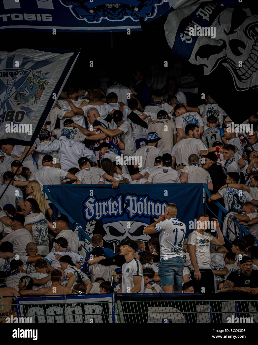Lech Poznań fans performing the 'Do the Poznań' celebration during the Champions League qualifying match against Crvena Zvezda in Poznań. Stock Photo