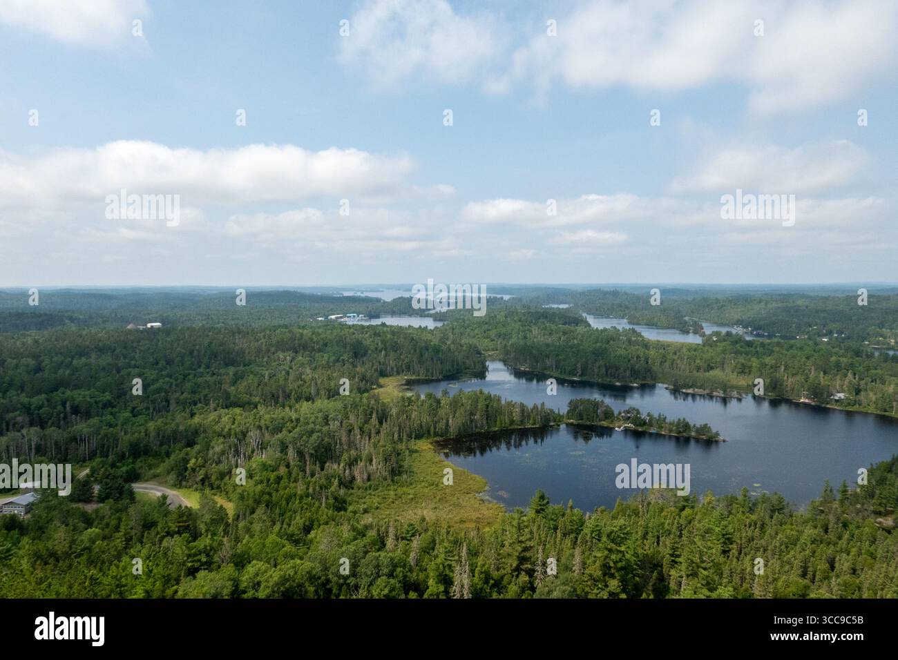 Temagami, Canada. 09th Aug, 2025. View of Temagami from Temagami Fire Tower. The Temagami Fire Tower, perched atop Caribou Mountain in Northeastern Ontario, offers panoramic views of the surrounding old-growth forests and Lake Temagami. Standing 100 feet tall, this steel structure was originally constructed in 1910 and has been restored to serve as a public lookout and historical site. Credit: SOPA Images Limited/Alamy Live News Stock Photo