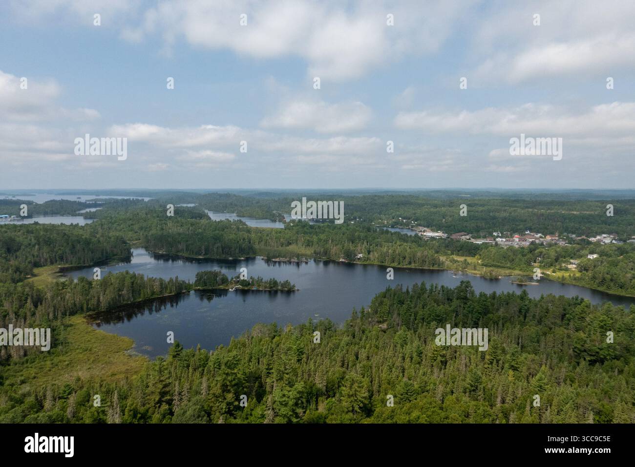 Temagami, Canada. 09th Aug, 2025. View of Temagami from Temagami Fire Tower. The Temagami Fire Tower, perched atop Caribou Mountain in Northeastern Ontario, offers panoramic views of the surrounding old-growth forests and Lake Temagami. Standing 100 feet tall, this steel structure was originally constructed in 1910 and has been restored to serve as a public lookout and historical site. Credit: SOPA Images Limited/Alamy Live News Stock Photo