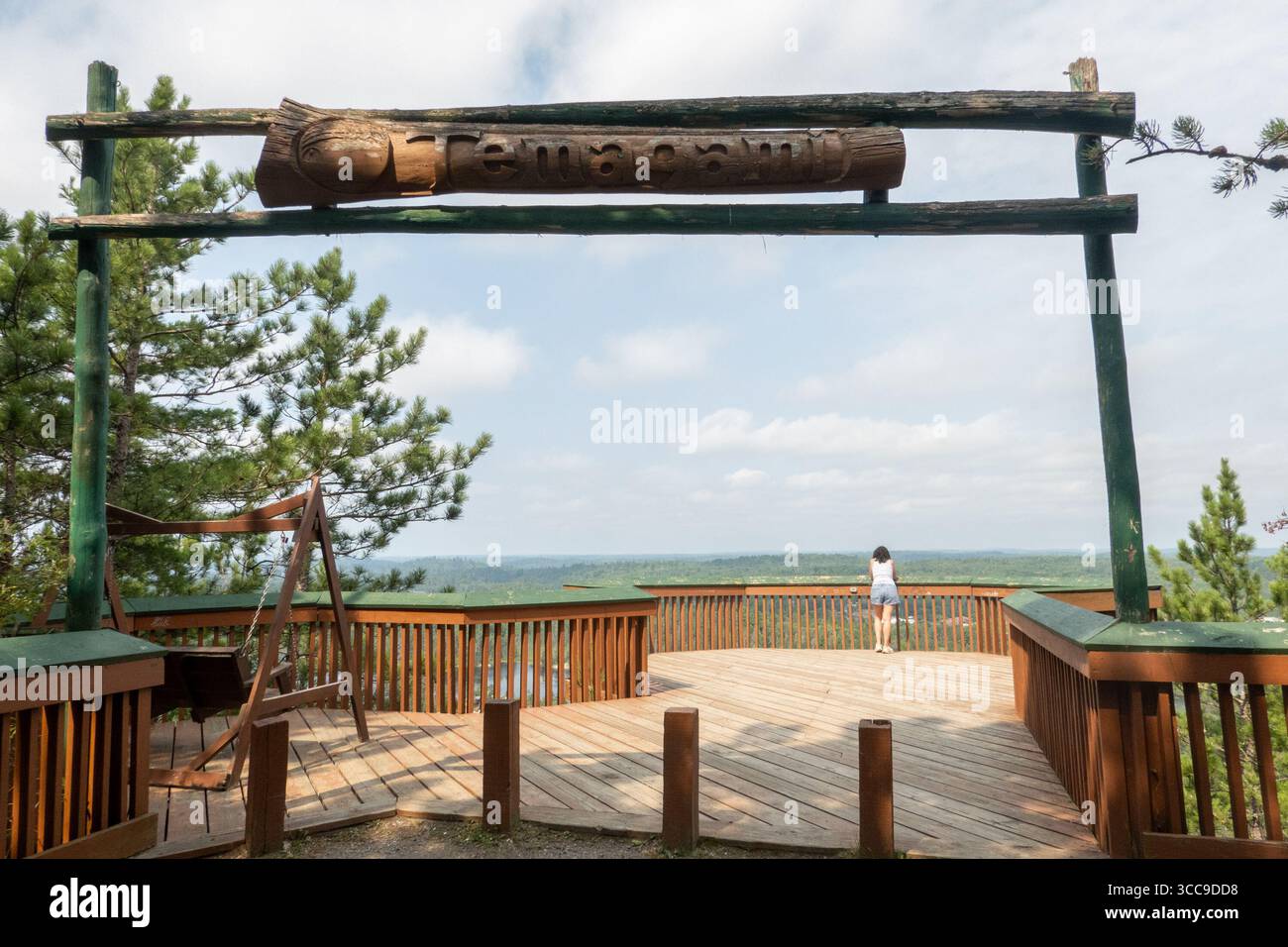 Temagami, Canada. 09th Aug, 2025. Tourists enjoy the view from the entrance of Temagami Fire Tower. The Temagami Fire Tower, perched atop Caribou Mountain in Northeastern Ontario, offers panoramic views of the surrounding old-growth forests and Lake Temagami. Standing 100 feet tall, this steel structure was originally constructed in 1910 and has been restored to serve as a public lookout and historical site. (Photo by Shawn Goldberg/SOPA Images/Sipa USA) Credit: Sipa USA/Alamy Live News Stock Photo