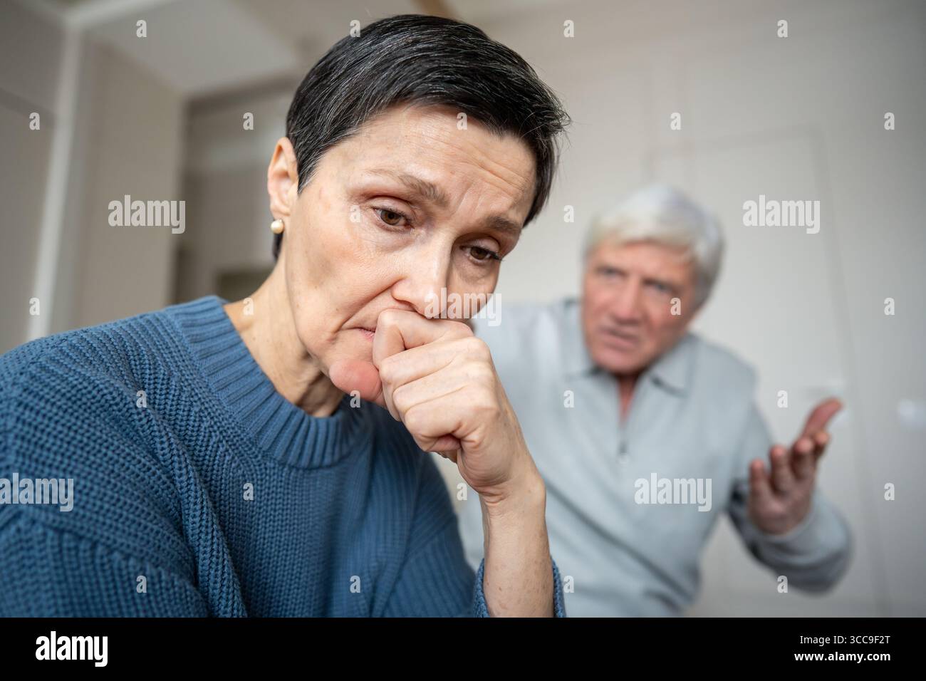 Heartbroken senior woman facing horrific news of unfaithful husband, deceit and emotional collapse Stock Photo