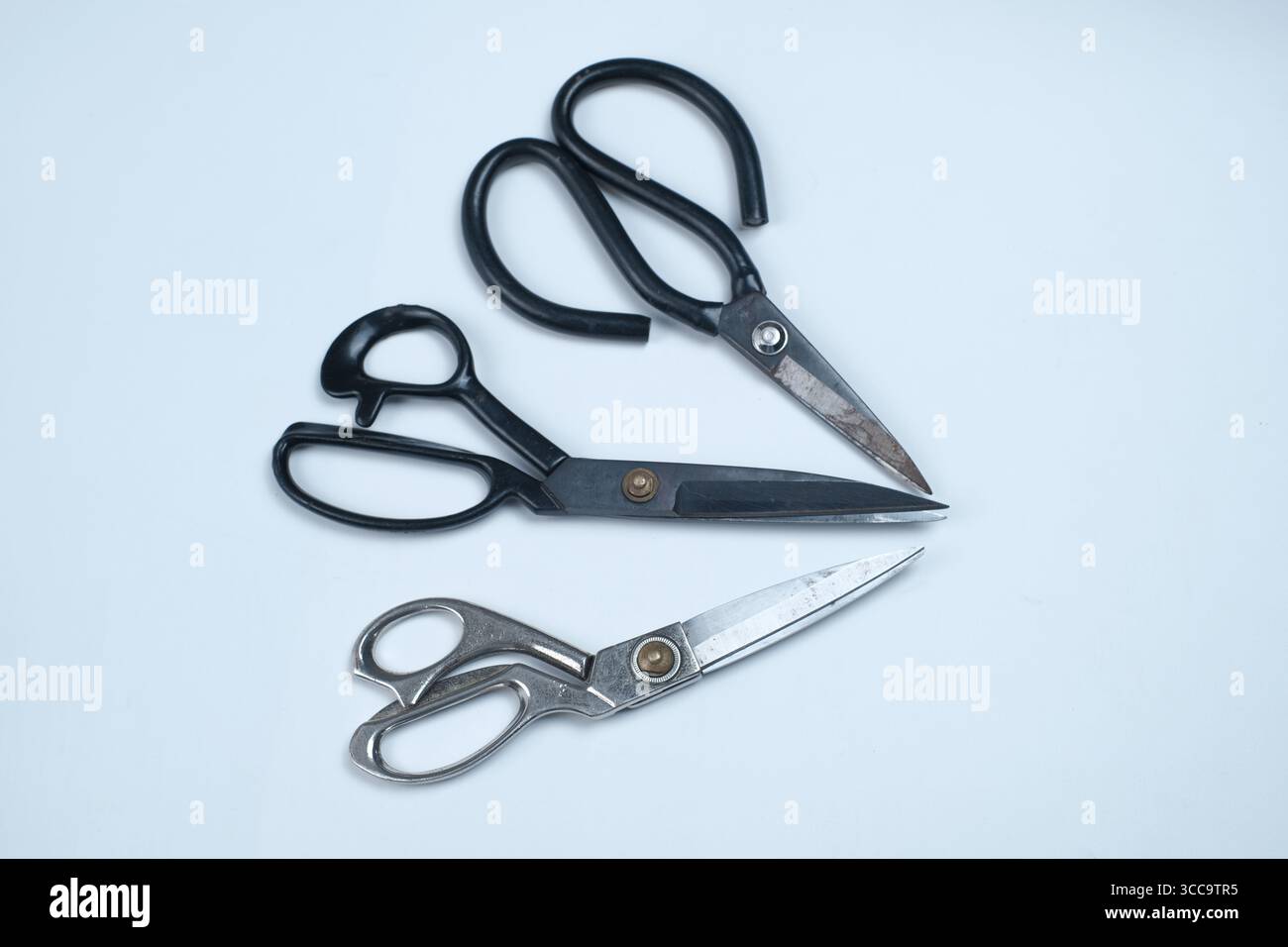 Fabric scissors, in various shapes isolated on white background. Stock Photo