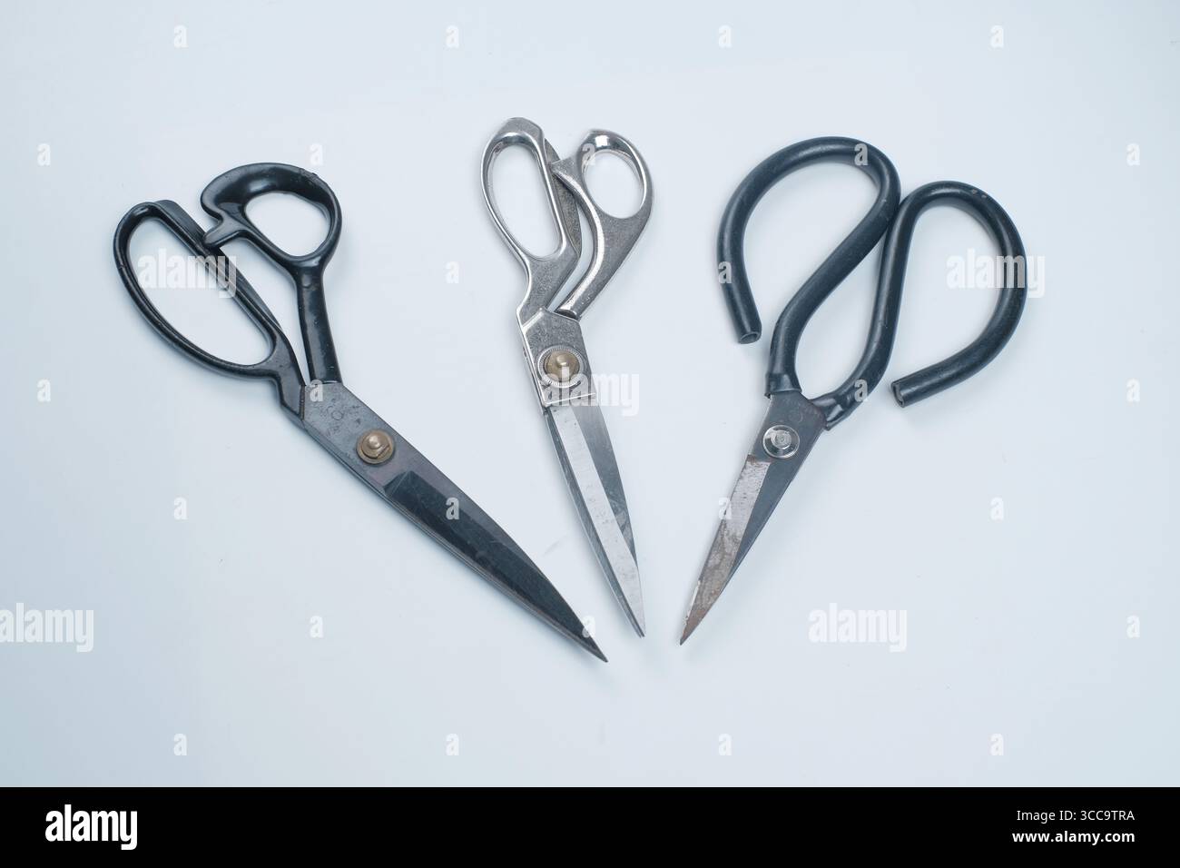 Fabric scissors, in various shapes isolated on white background. Stock Photo