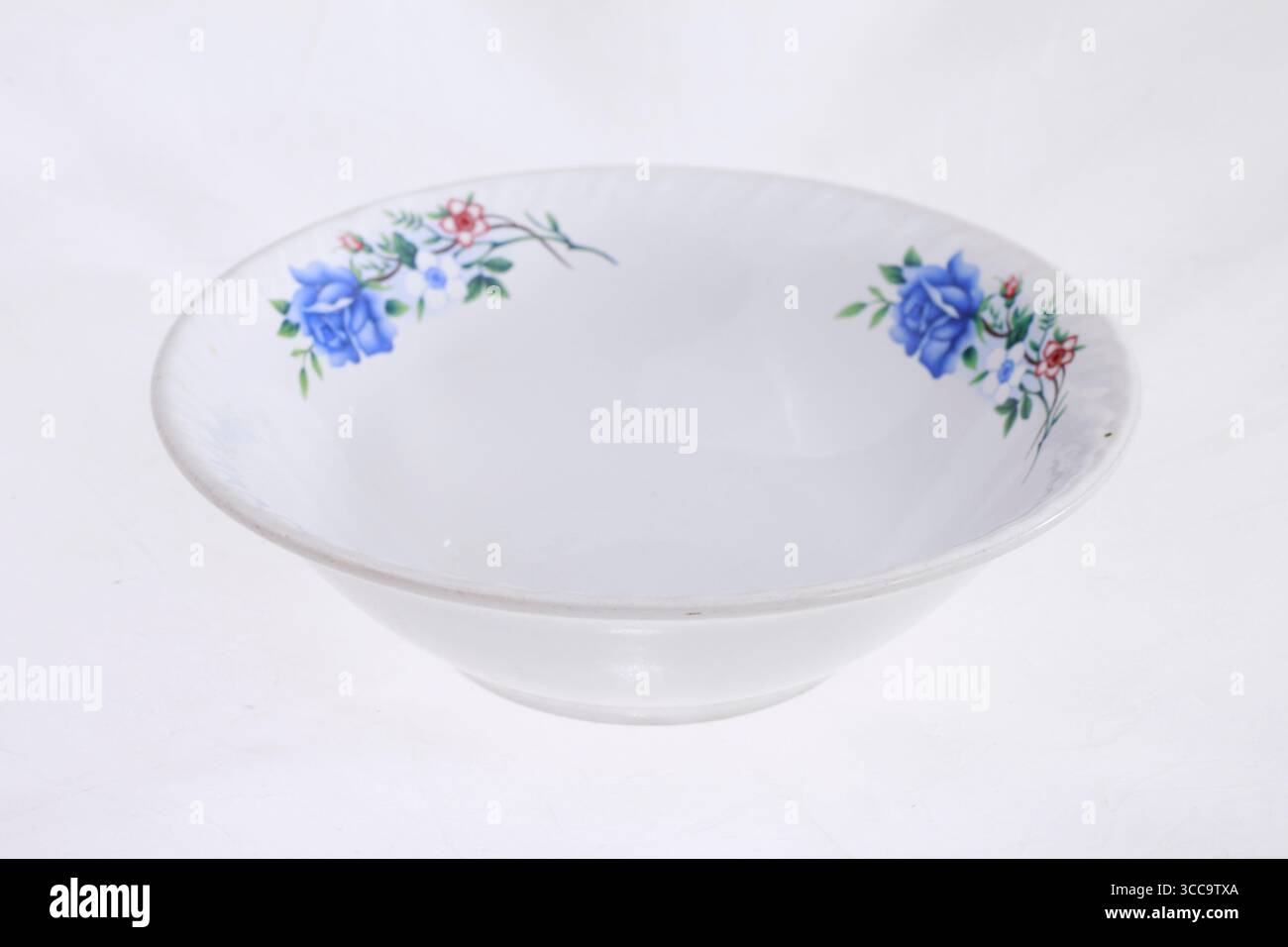 Empty floral patterned bowl isolated on white background. Stock Photo