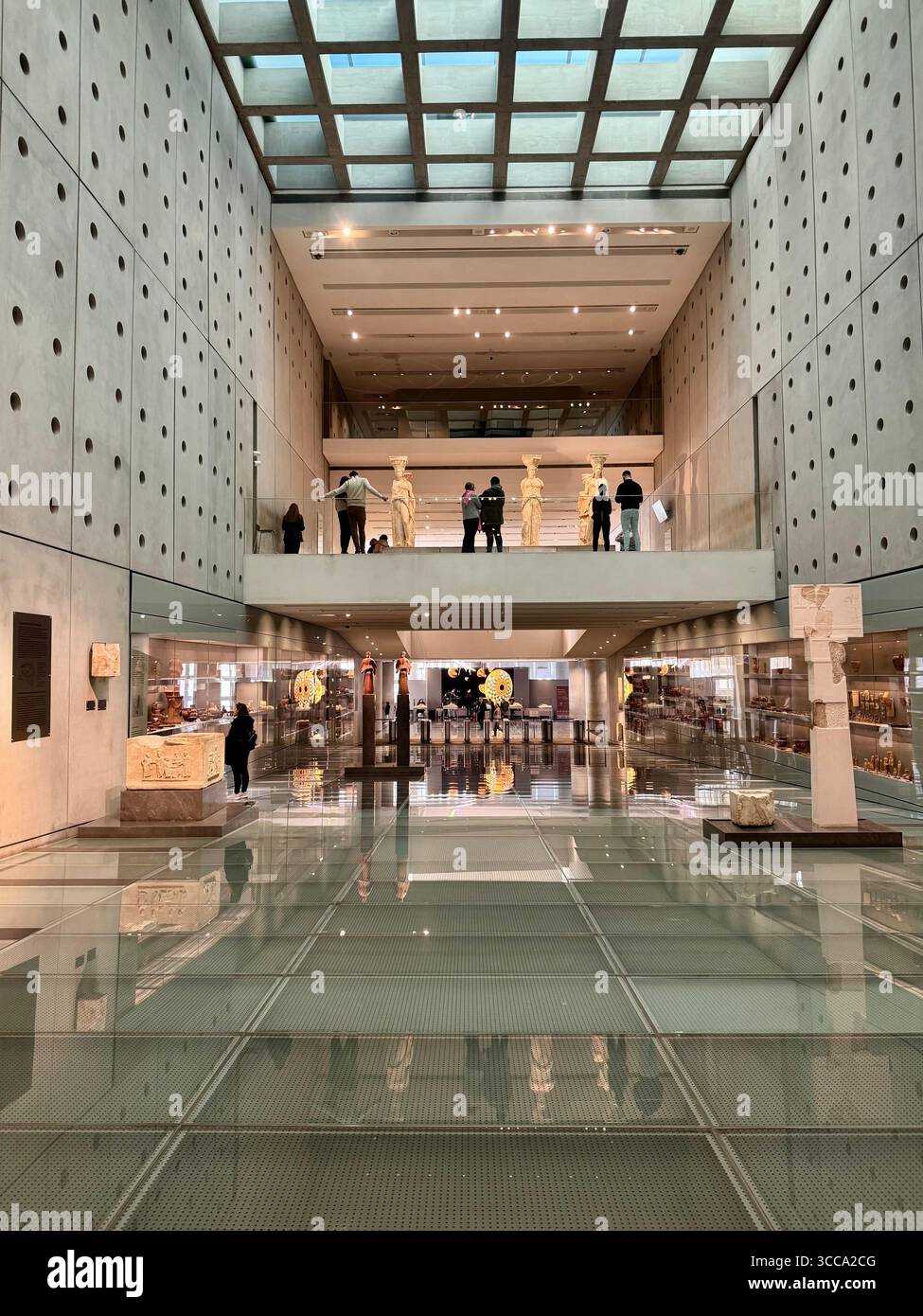Interior views of the Acropolis Museum in Athens, Greece, with modern glass floors and archaeological displays. - Smartphone Captured Stock Image
