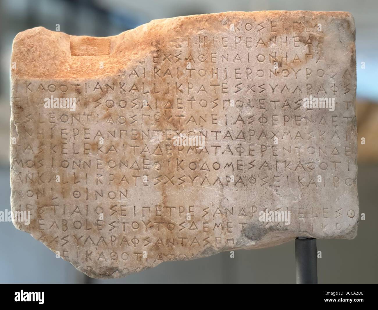 Ancient stone inscription artifact displayed at the Acropolis Museum, Athens, Greece. - Smartphone Captured Stock Image