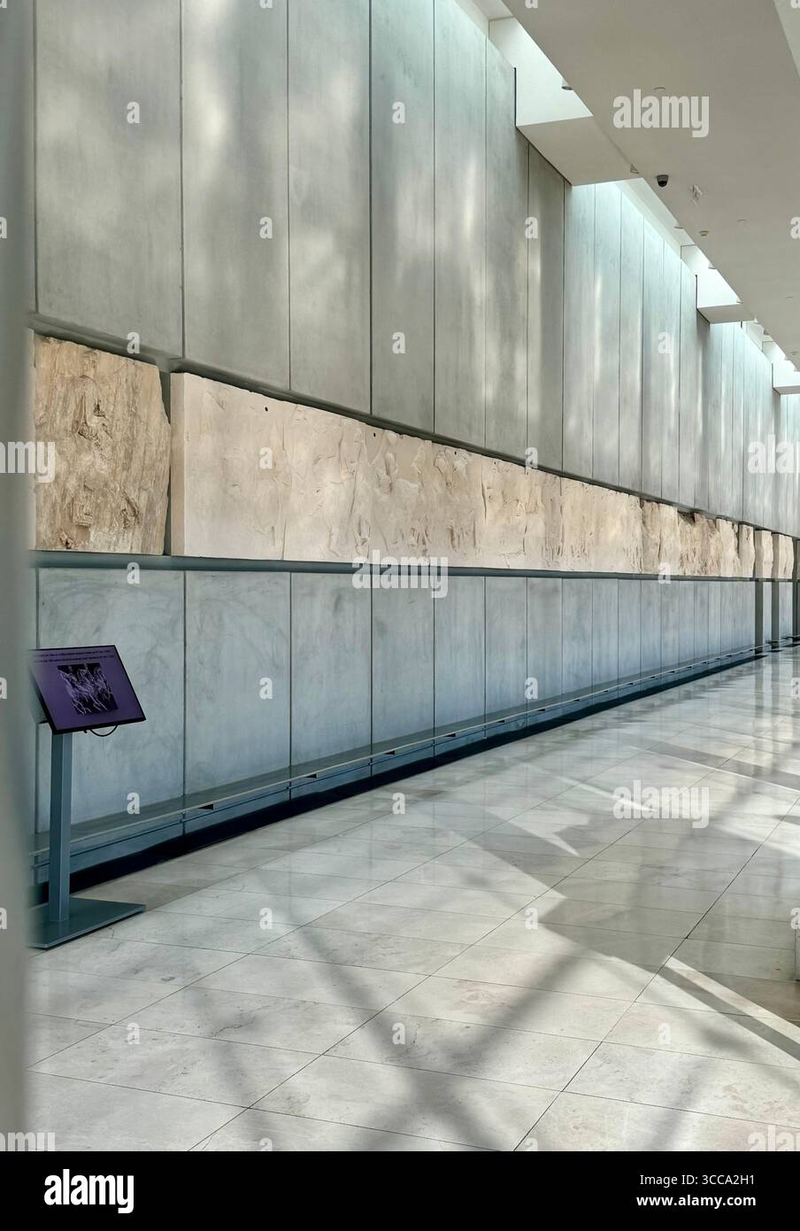 Interior views of the Acropolis Museum in Athens, Greece, featuring Parthenon marble sculptures and friezes. - Smartphone Captured Stock Image