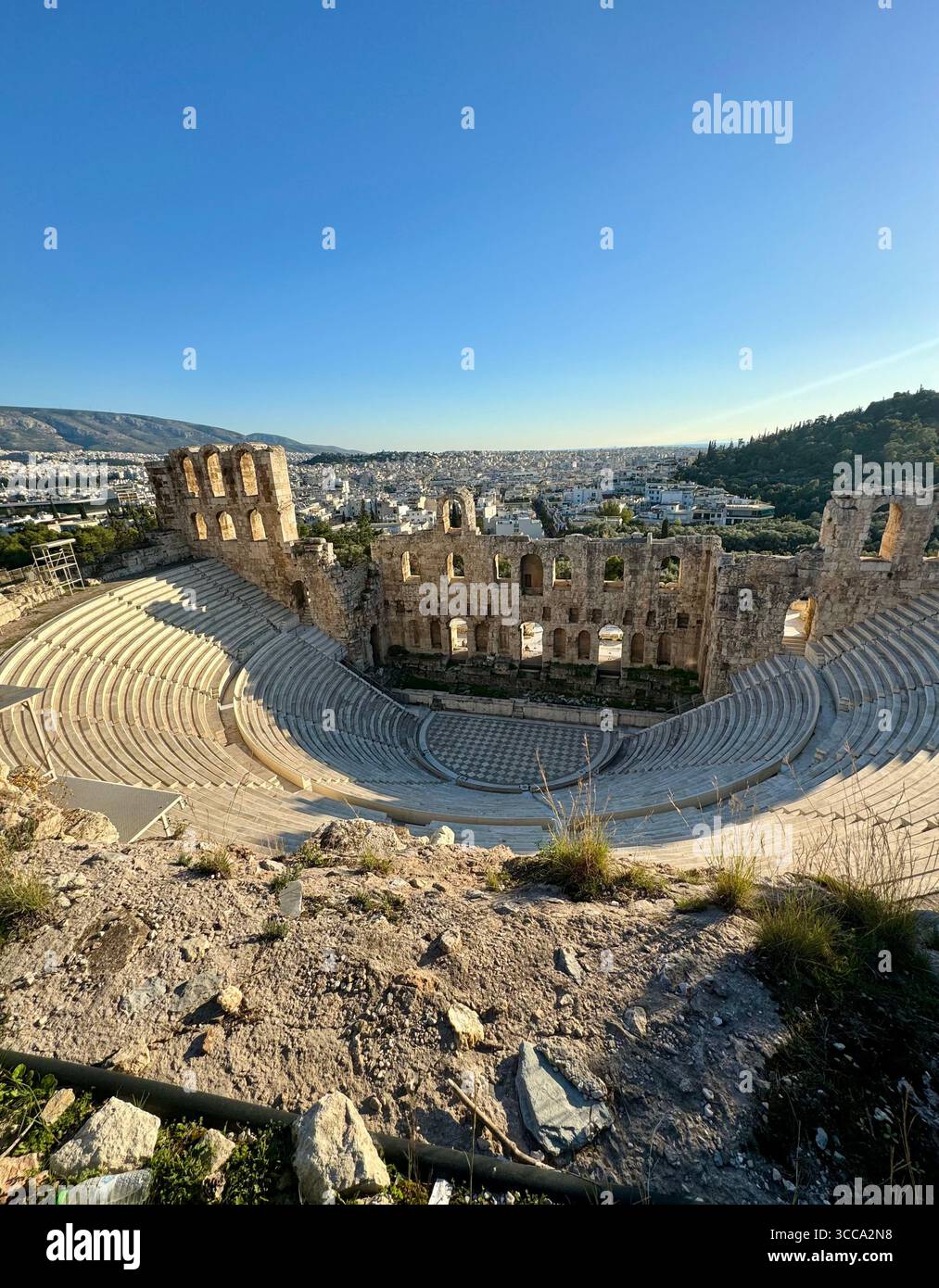 Odeon of Herodes Atticus ancient stone theater in Athens with panoramic city view - Smartphone Captured Stock Image
