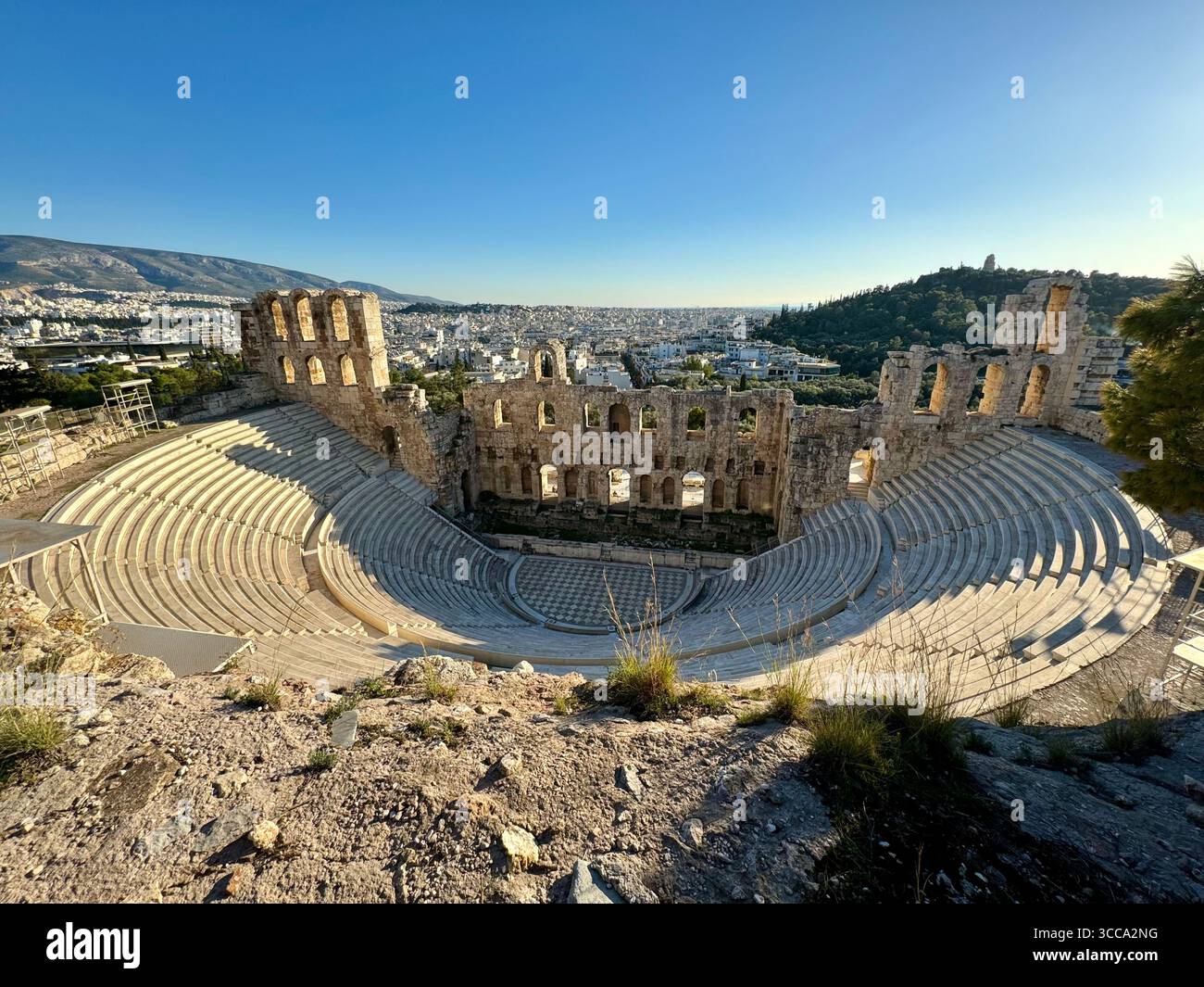 Odeon of Herodes Atticus ancient stone theater in Athens with panoramic city view - Smartphone Captured Stock Image