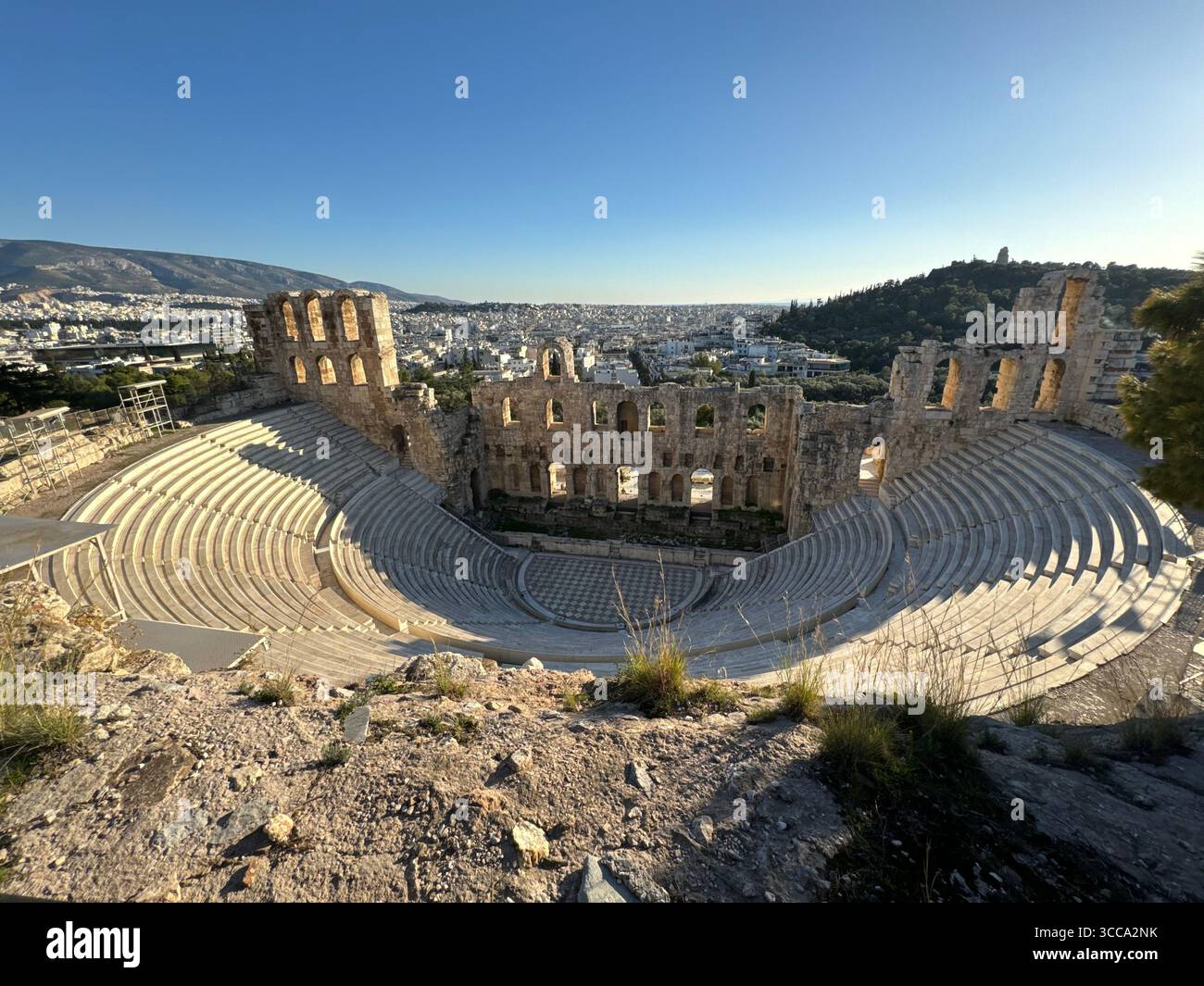 Odeon of Herodes Atticus ancient stone theater in Athens with panoramic city view - Smartphone Captured Stock Image