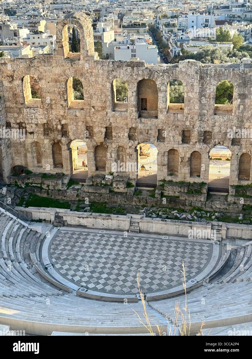 Odeon of Herodes Atticus ancient stone theater in Athens with panoramic city view - Smartphone Captured Stock Image