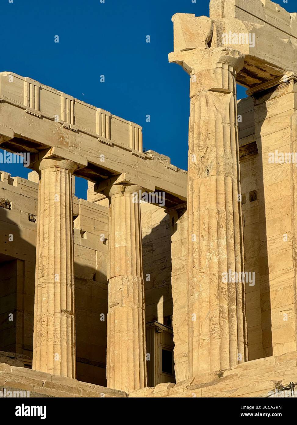 Acropolis Propylaea, the ancient monumental gateway to the Acropolis of Athens, featuring white marble Doric columns dating back to 432 BC. - Smartphone Captured Stock Image