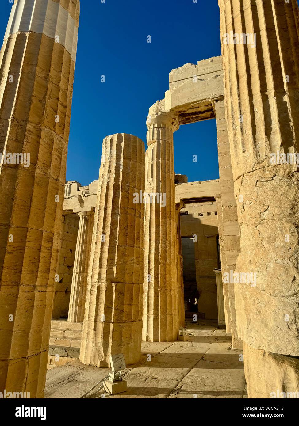 Acropolis Propylaea, the ancient monumental gateway to the Acropolis of Athens, featuring white marble Doric columns dating back to 432 BC. - Smartphone Captured Stock Image