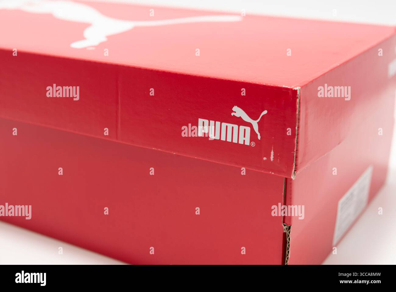 Red box of PUMA Men's Deviate Nitro 2 running shoes, isolated on white background. Stock Photo