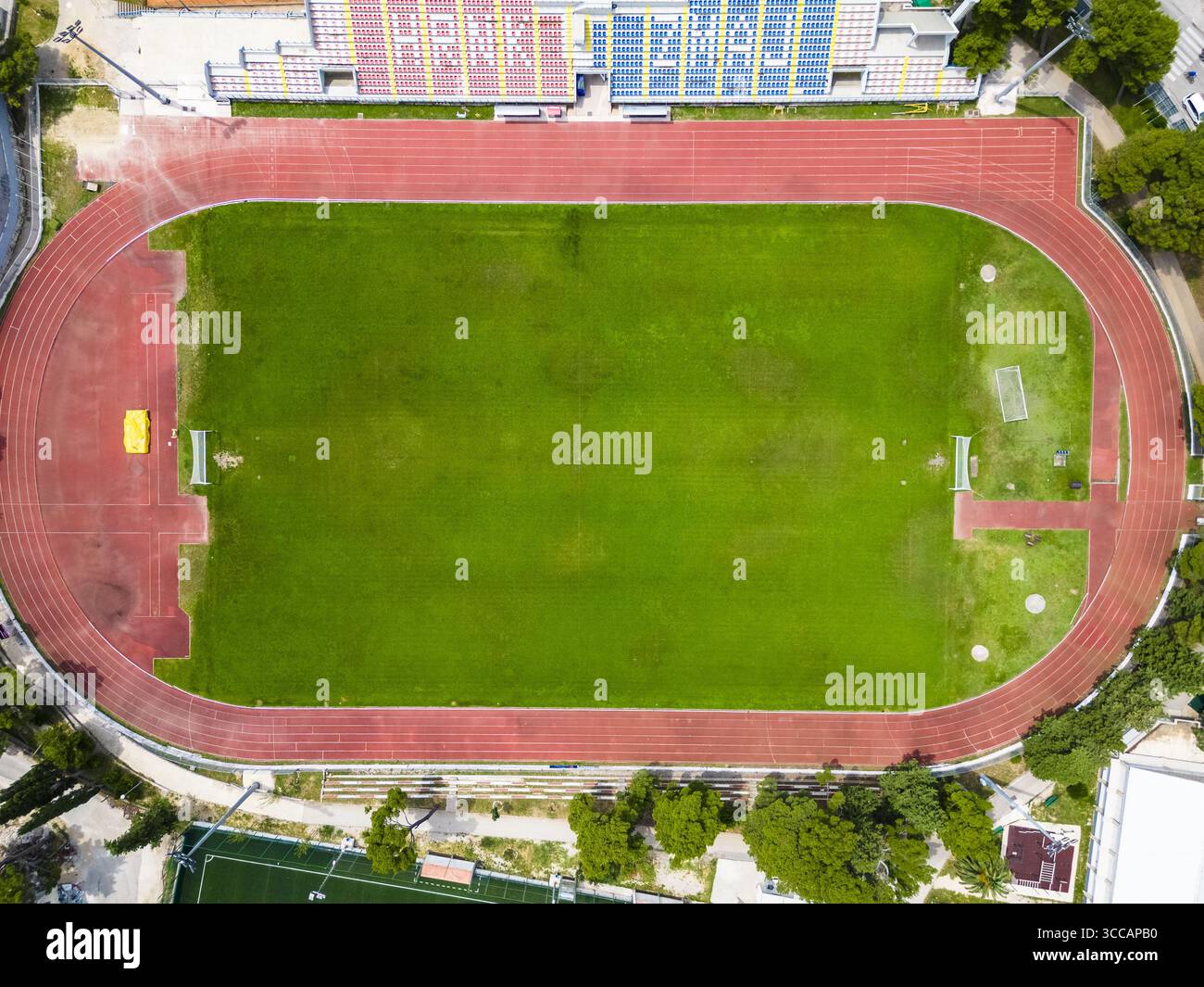 Running Ractangle Track Aerial view of the vibrant green rectangle of a sports field encircled ...
