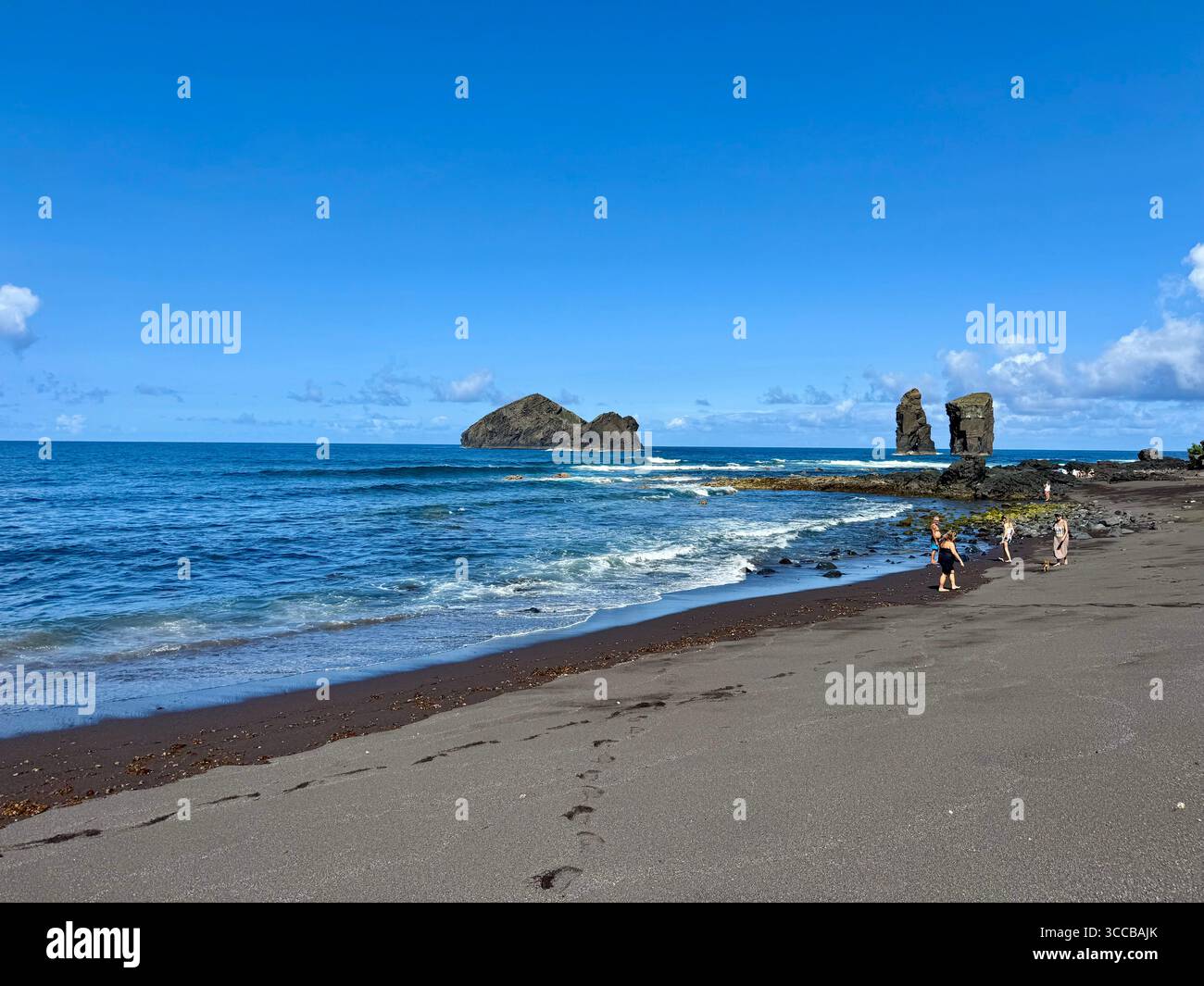 Mosteiros Beach in the Azores, Portugal, with the iconic Mosteiros islets in the background on a clear summer day. - Smartphone Captured Stock Image