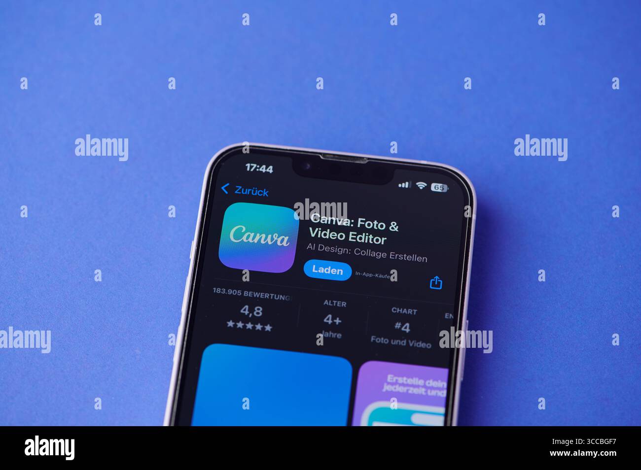 A Smartphone Screen Shows The Canva Logo Against A Blue Background Stock Photo