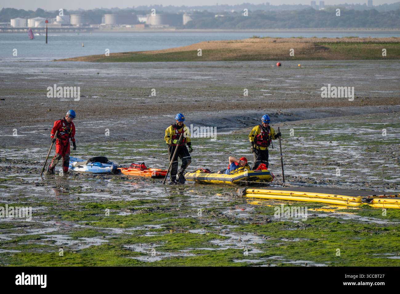 A stranded canoeist is rescued by Coastguard Rescue at Calshot, Hampshire, England, United Kingdom. Stock Photo