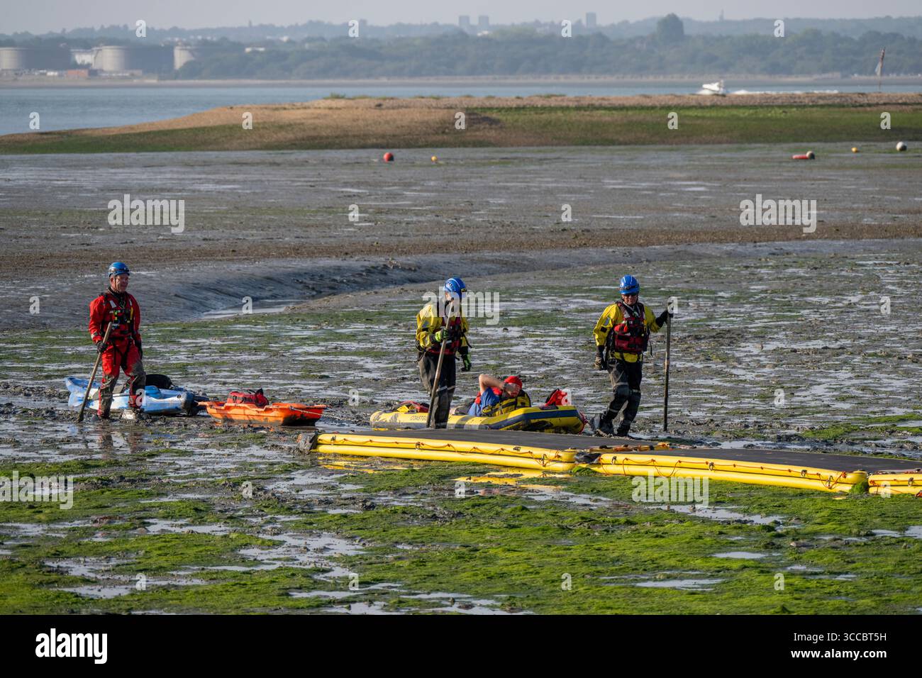 A stranded canoeist is rescued by Coastguard Rescue at Calshot, Hampshire, England, United Kingdom. Stock Photo