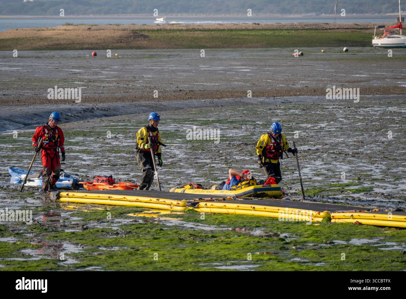 A stranded canoeist is rescued by Coastguard Rescue at Calshot, Hampshire, England, United Kingdom. Stock Photo